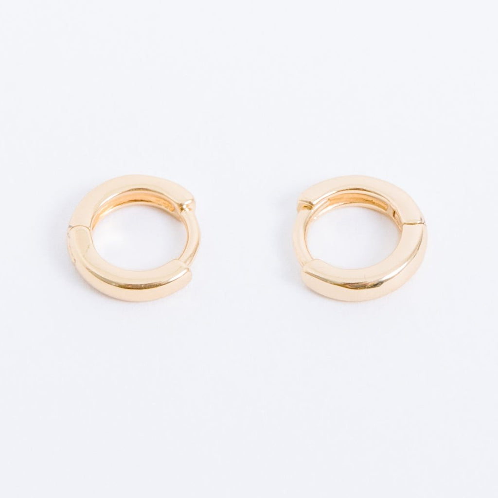 14k gold filled. Safe for sensitive skin. Unique clasp has no post when earrings are closed, allowing for comfortable wear and sleep without having to remove earrings. Available in 9 mm and 16 mm, Hypoallergenic, While gold filled is a strong, sturdy metal for maximum lifespan we don't recommend subjecting the earrings to lots of chemicals, waters, perfumes, etc.