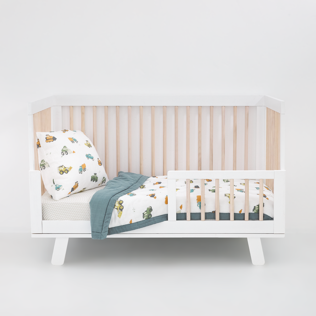 Celebrate their imagination. The Toddler Bedding Set features a variety of themes and prints to help bring their creativity to life as they transition from infant to toddler. 3 piece set includes: 1 Toddler Comforter, 1 crib sheet, 1 pillowcase.  Cotton Muslin Toddler Bedding 3 Piece Set - Work Trucks