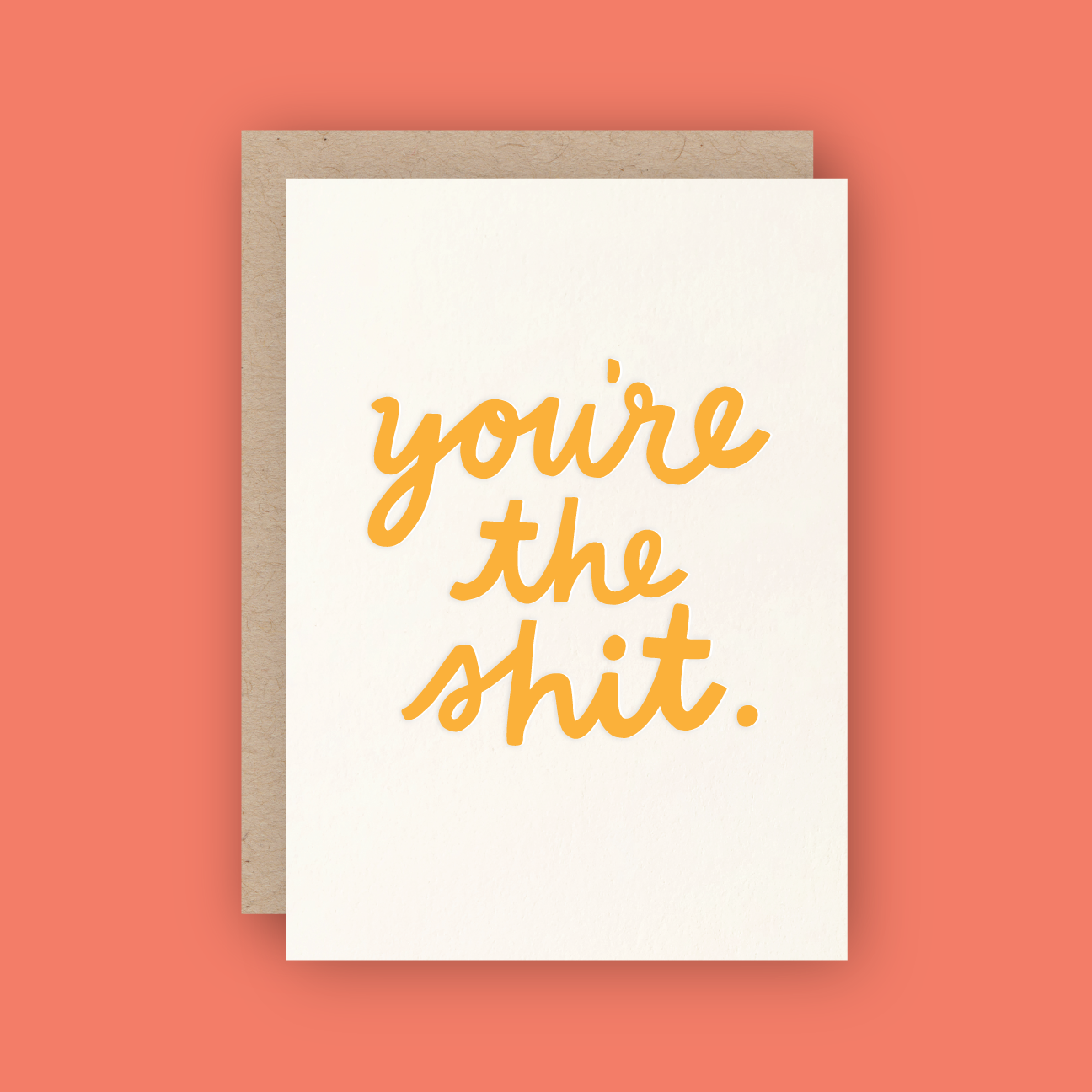 white card reading "you're the shit." in orange ink