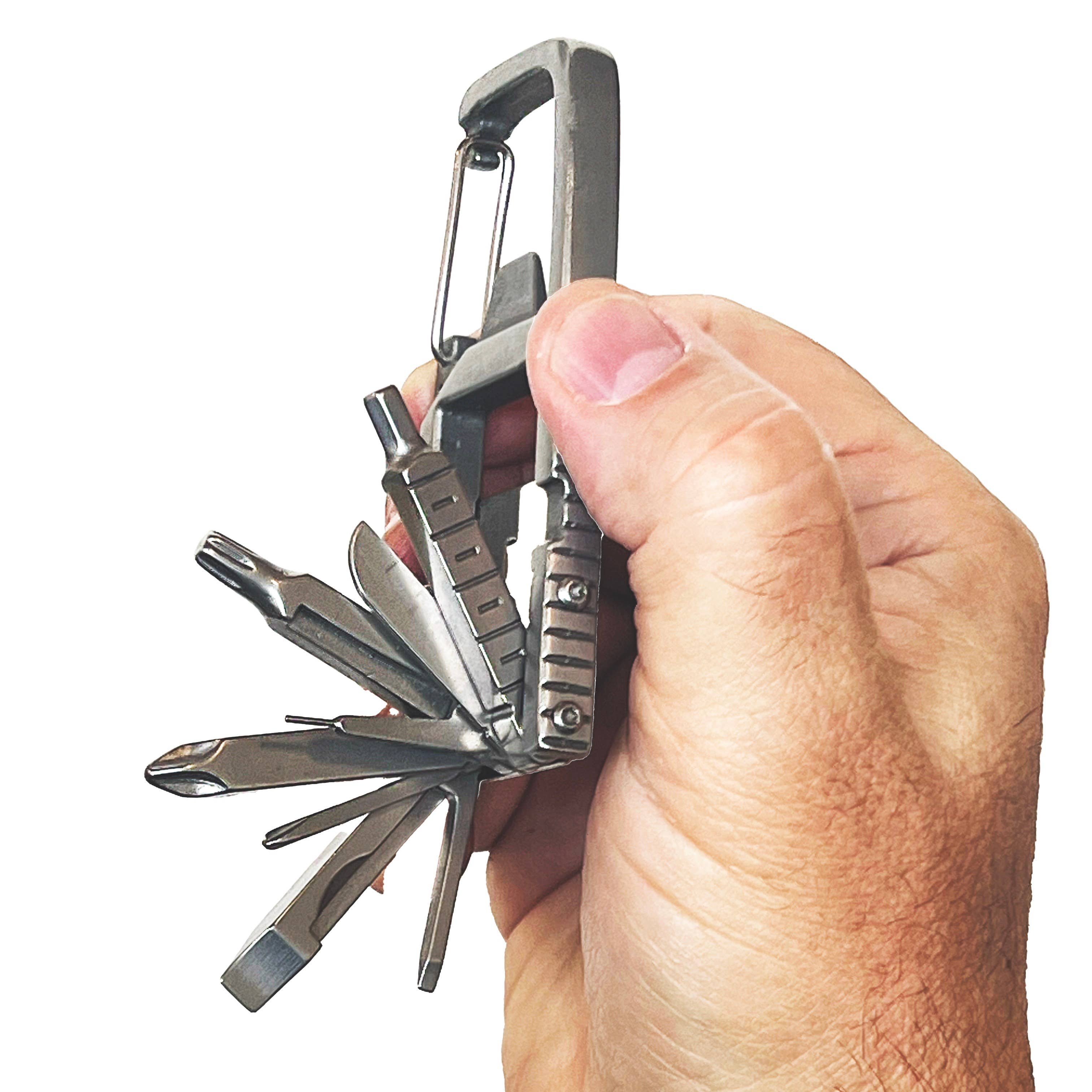Multitool keychain held in a hand against a white background