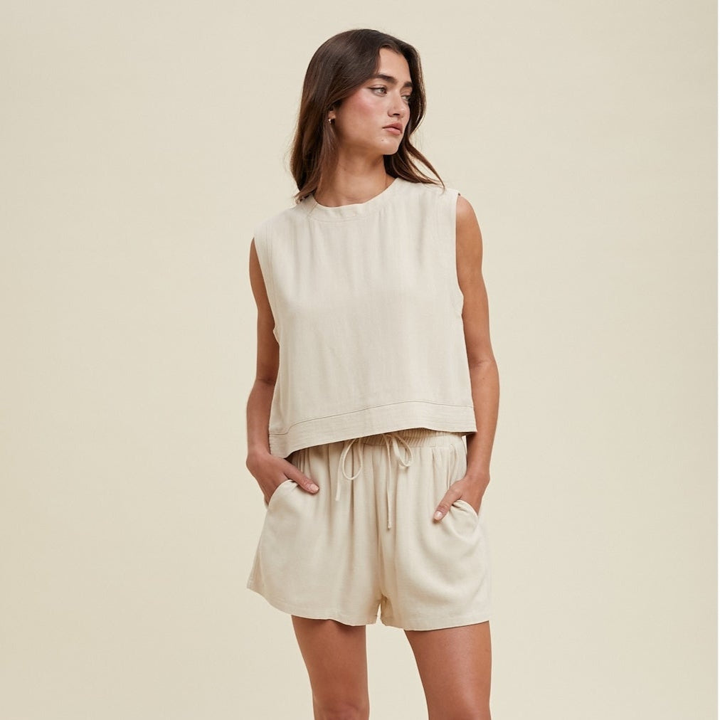 Stay comfortable and stylish in our Linen Tank Top and Shorts Set. Made with natural linen, this set offers a lightweight and breathable option for warmer days. The tank top and shorts provide a flattering and versatile combination that can be dressed up or down for any occasion. Perfect for effortless summer style.
