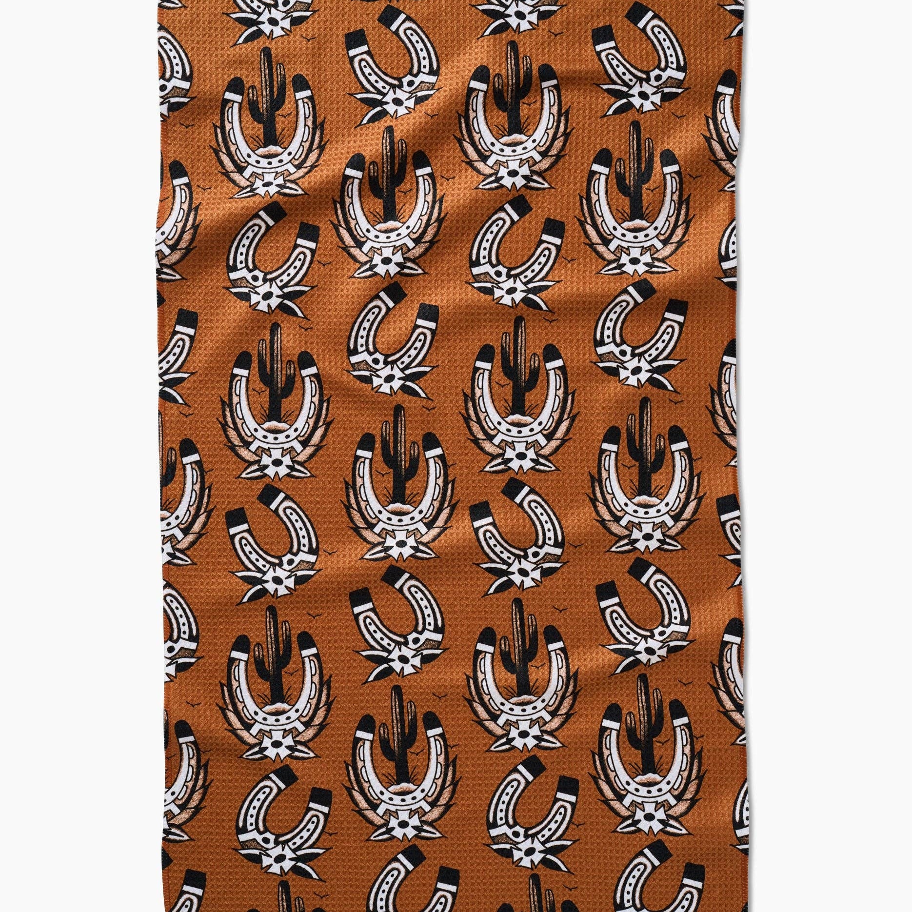 Patterned fabric with horseshoe design on a brown background