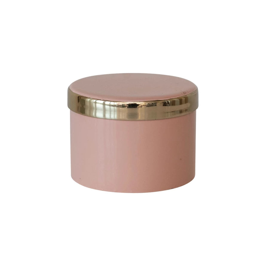 This pink enameled metal box with gold interior is a beautiful and classy piece that can add some charm to any space. The box features a round metal shape with a pink enameled coating that gives it a smooth and glossy look. The interior of the box has a gold finish that adds a touch of luxury and glamour.