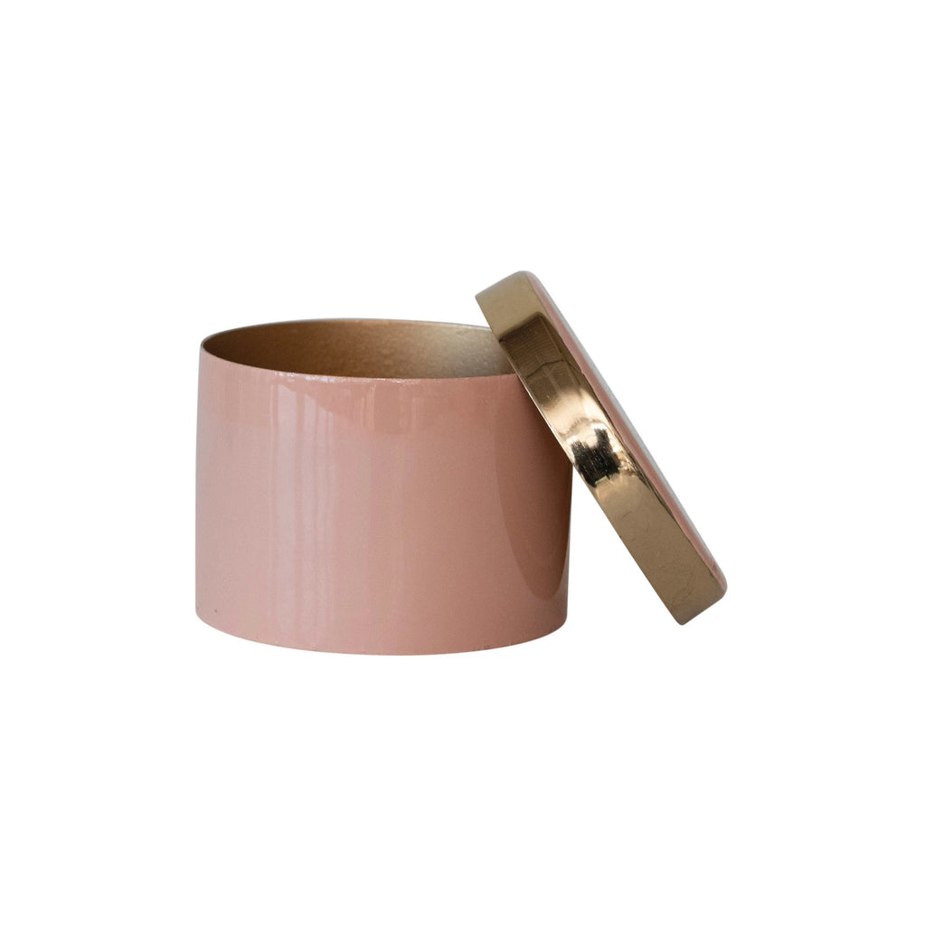 This pink enameled metal box with gold interior is a beautiful and classy piece that can add some charm to any space. The box features a round metal shape with a pink enameled coating that gives it a smooth and glossy look. The interior of the box has a gold finish that adds a touch of luxury and glamour.