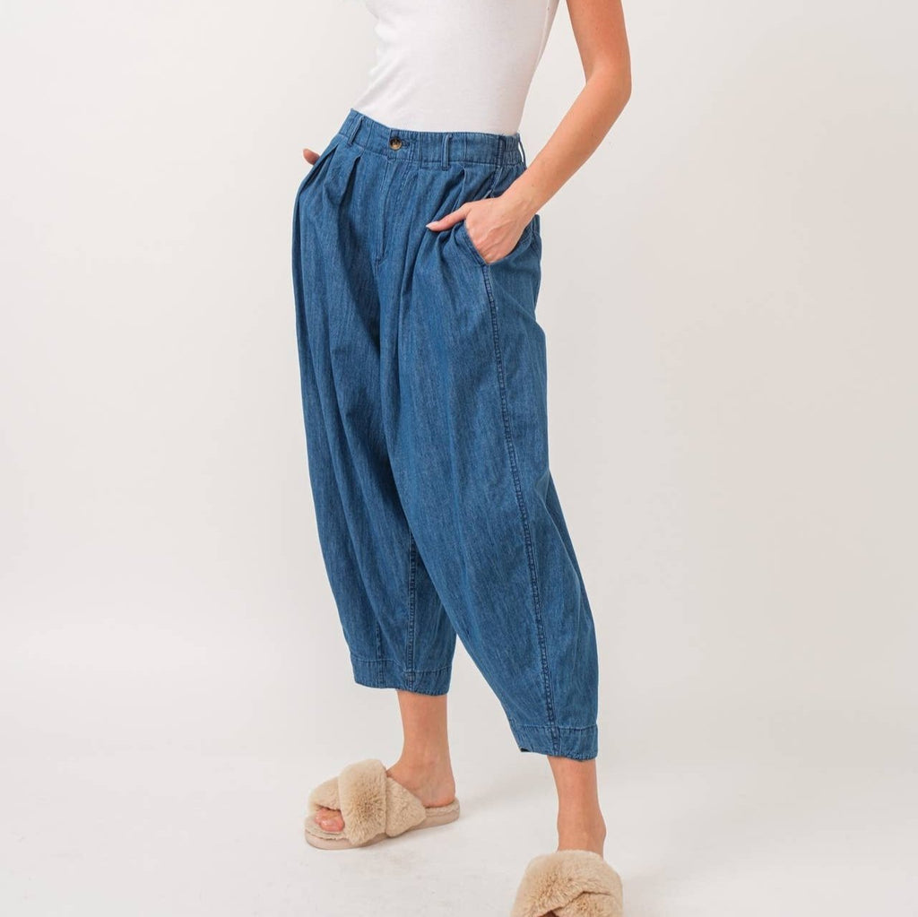 Quinn Pants are crafted from lightweight denim, offering a relaxed fit with a pleated front detail for added flair. The elastic back waist ensures comfort without compromising style.