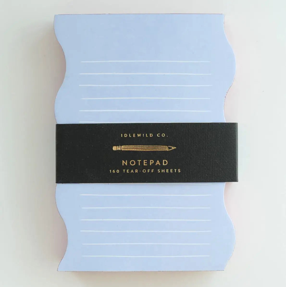 Light blue notepad with a black band featuring text on a white background