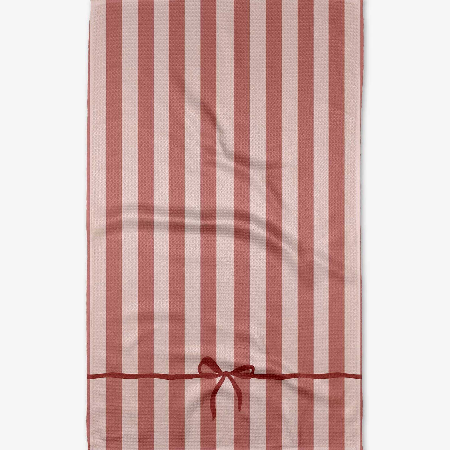 A tea towel with red and pink stripes and an image of a bow tied at the bottom. 
