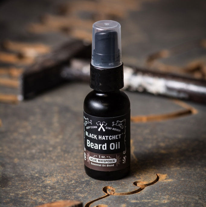 Black hatchet beard oil softens, tames, shapes, and adds a healthy shine to beards, mustaches, and eyebrows. It is a blend of light, rich oils that absorb into the skin quickly.
It is enriched with 100% pure essential oils. Rosemary, eucalyptus, and spruce blend.  1 oz. Glass bottle with no-mess dispenser.