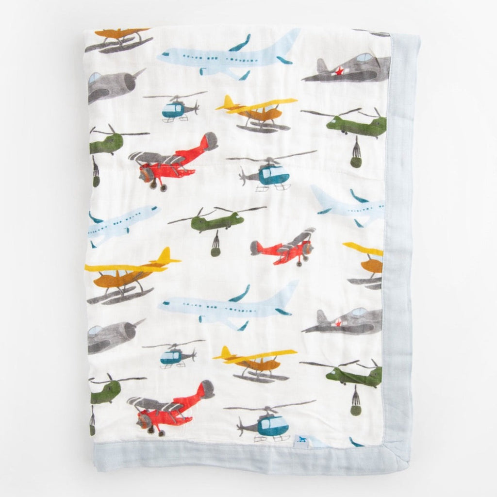 Say hello to this cute baby quilt, certain to be a favorite in your little one's blanket collection. Made from three layers of 100% cotton muslin, it's just as durable as it is soft, cozy and breathable. Perfectly sized for snuggles, tummy time or on-the-go in your favorite stroller or jogger. Printed on both sides with our signature artwork for a beautiful touch to any nursery, and as a perfect shower gift. Deluxe Muslin Baby Quilt - Air Show.      Materials  100% cotton muslin.