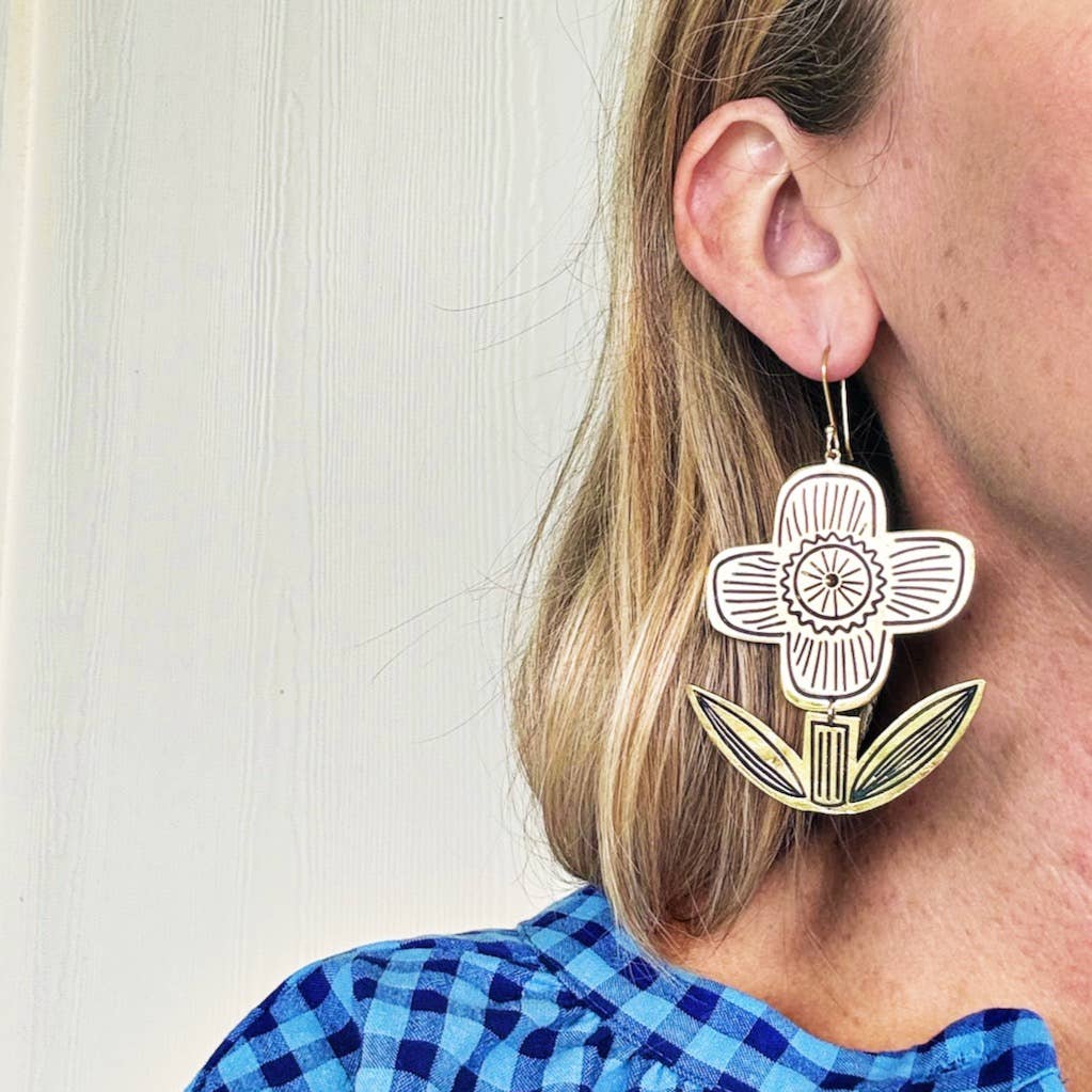 Let a little Sunny shine in! Inspired by the Handker floral illustrations you love, these large beauties feature a hinge design that catches the light as it moves with you.