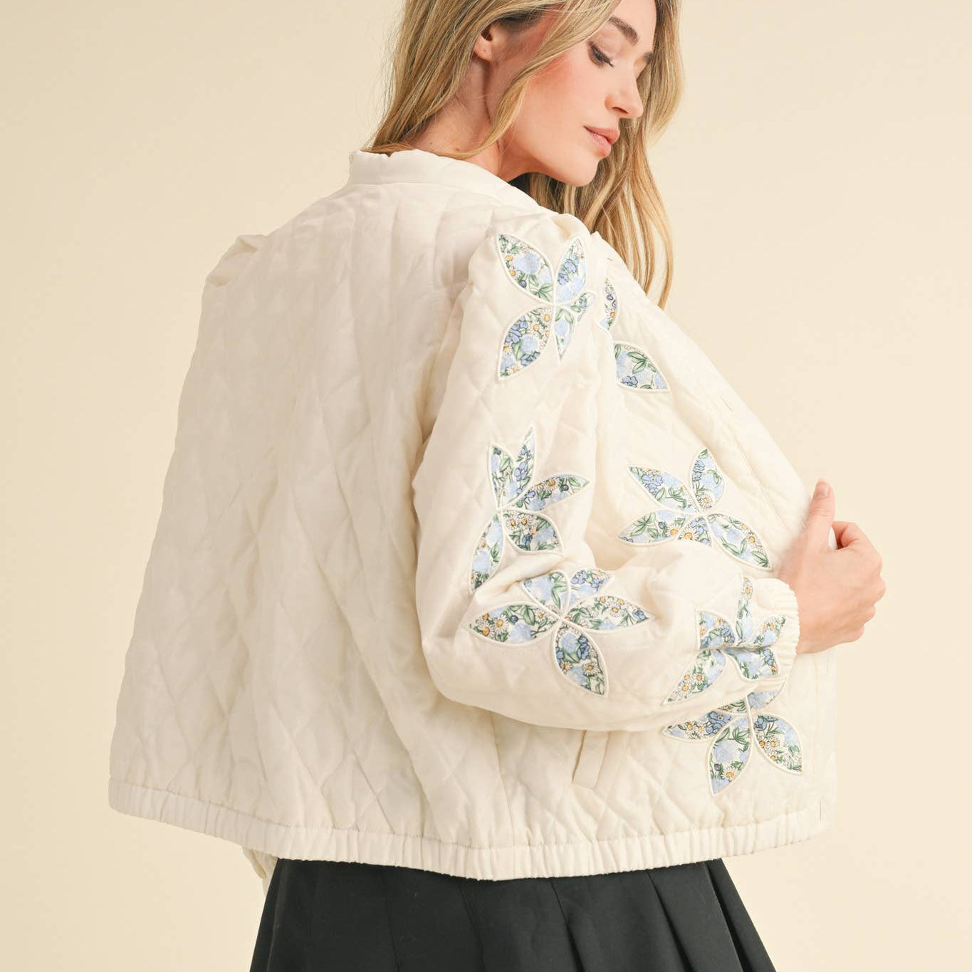 Be a style icon in this quilted floral jacket! Sturdy quilted puffer shapes this chic jacket that features embroidered floral patchwork throughout. It has a button down closure, long sleeves, and gathered puff at the shoulders. Elastic cuffs, hem, and side pockets complete the look.
