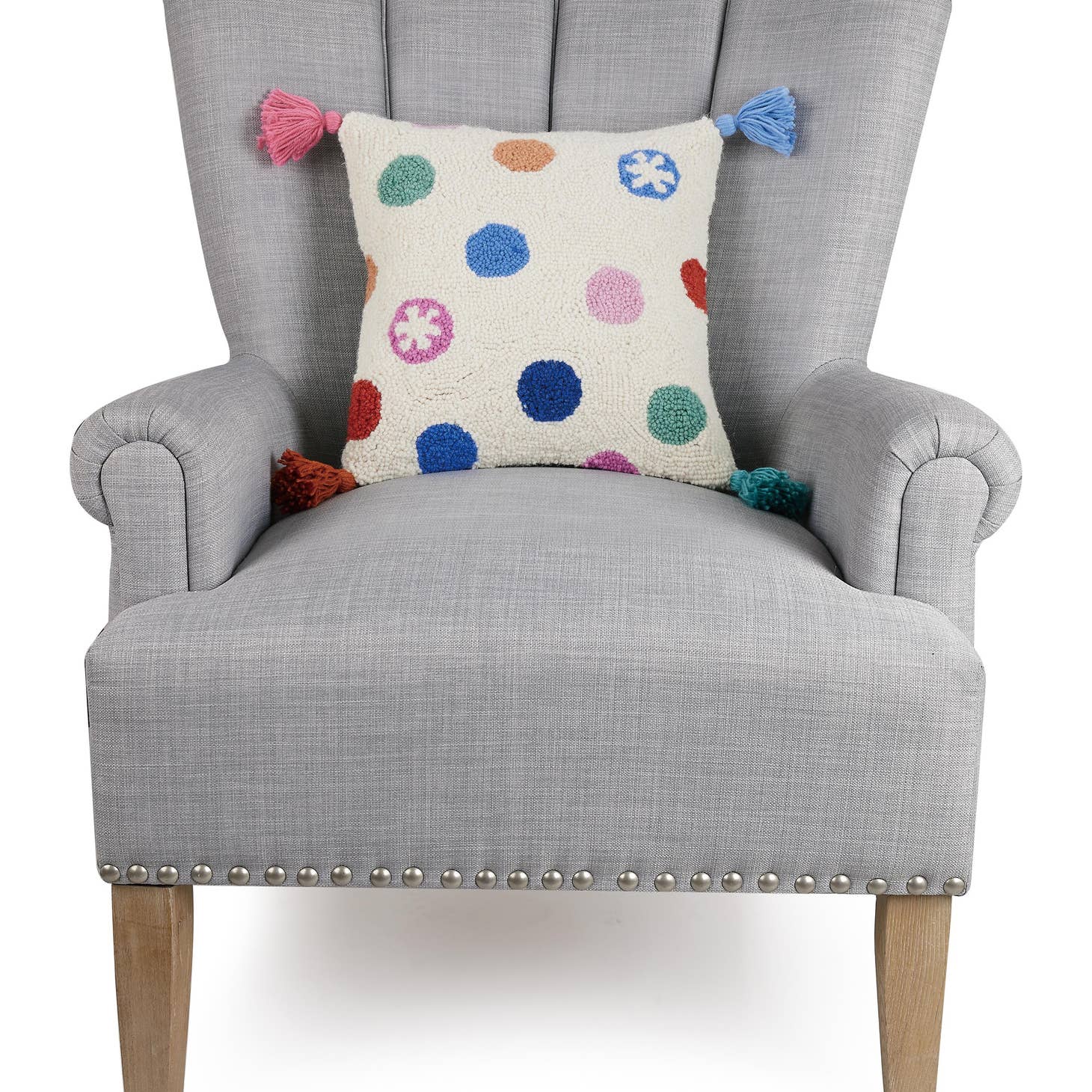 Dress up any room with this dotty delight! This Dots W/Tassels Hook Pillow adds personality and pizzazz with its playful dot pattern and tassel accents. Who knew dots could be so stylish? (Seriously, though - this pillow is seriously cute!)     Description  100% wool hooked rectangular accent pillow   100% cotton velvet backing  Includes polyester insert, zipper closure   Size  14x14 inches
