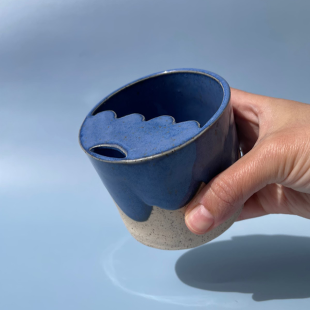 gray sipper travel cup with blue details