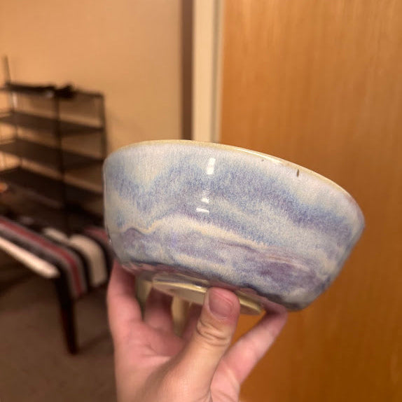 A blue and purple glazed bowl. 