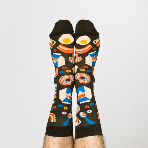 Breakfast? More like breakFEAST! These socks are decorated with all the fixings to a great breakfast or brunch: eggs, bacon, donuts, milk, and cereal. Even better: when you put your feet together, the eggs and bacon line up to create a smiley face.

Wake up in the morning and slide these on to get in the spirit of your first meal immediately or give as a gift to a breakfast-lover or a gift for a fun dad or grandpa on Father's Day. Whoever's wearing these will be dancing their way to the breakfast tab