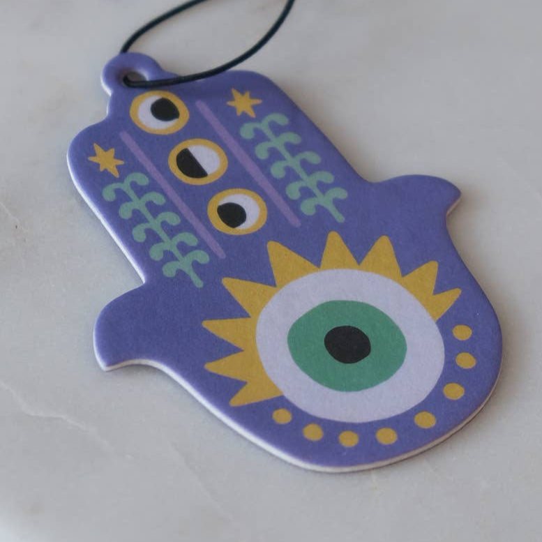 Decorative Hamsa hand pendant air feshener with colorful design on a white background