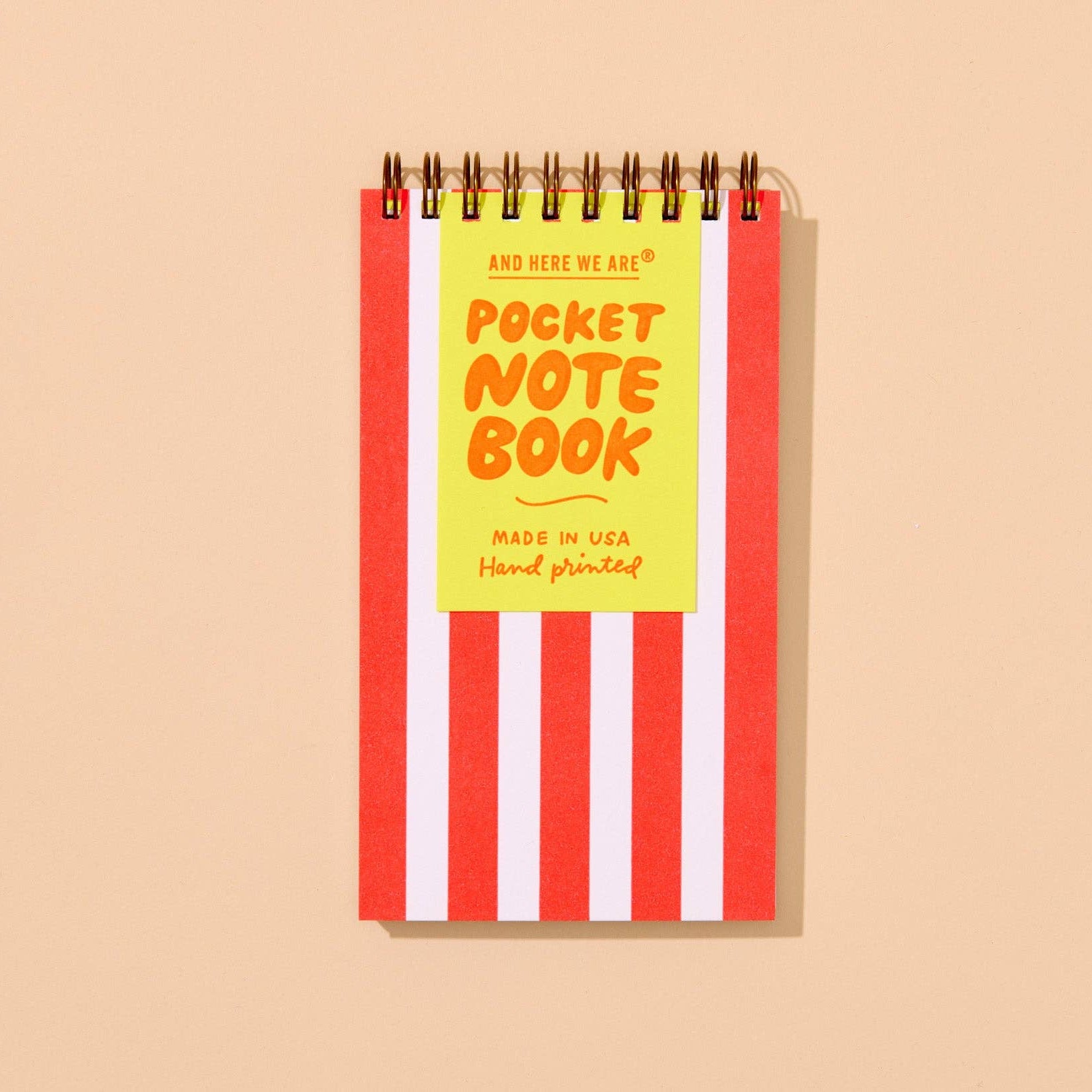 This versatile little letterpress notebook, hand-printed with bold neon red stripes in a perfect, portable pocket-size size for everyday notes and lists, with 60 lined pages. Whether you see a beach towel, a popcorn box, or a candy cane... this one fits into every season. Handmade in Columbus, Ohio.

Details:

Small pocket size letterpress printed spiral notebook
3.5" x 6" size fits in your pocket or purse