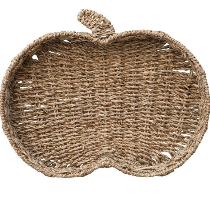 Woven basket shaped like a pumpkin on a white background