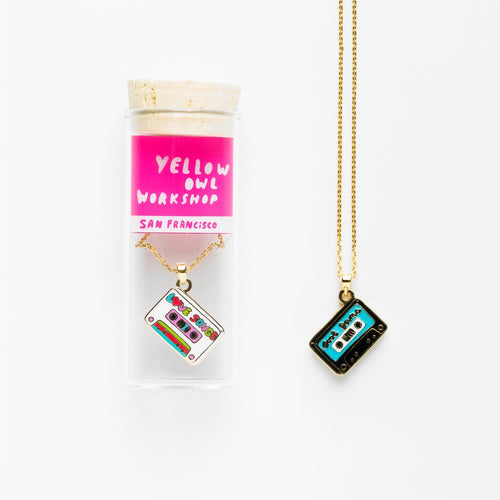 Our brand new double-sided pendants let you choose which colorful side to wear. Yup, that's right! Two designs for the price of one. Just like our other pendants, these double-the-fun pieces are on an 18k gold-dipped 20" chain (50.8 cm) with clasp. Presented in our signature glass vial and cork packaging on a clear insert so you can see both designs.&nbsp;