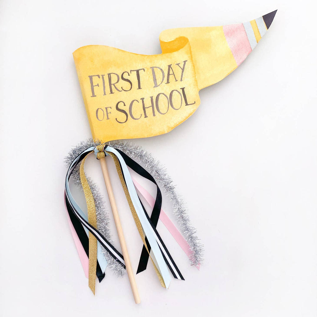 This pencil-inspired party pennant is a fun take on a classic back-to-school sign! Plus, you even have extra space to write in the date, grade, or year to make it extra-personal. Three cheers for you: hip, hip, hooray! This flag adds joy to any day. Hold it in a photo or pop on a cake. Wave it with glee & give the ribbons a shake. A celebration with flair is more fun, isn’t it? Let the merriment begin with this Cute party pennant!
