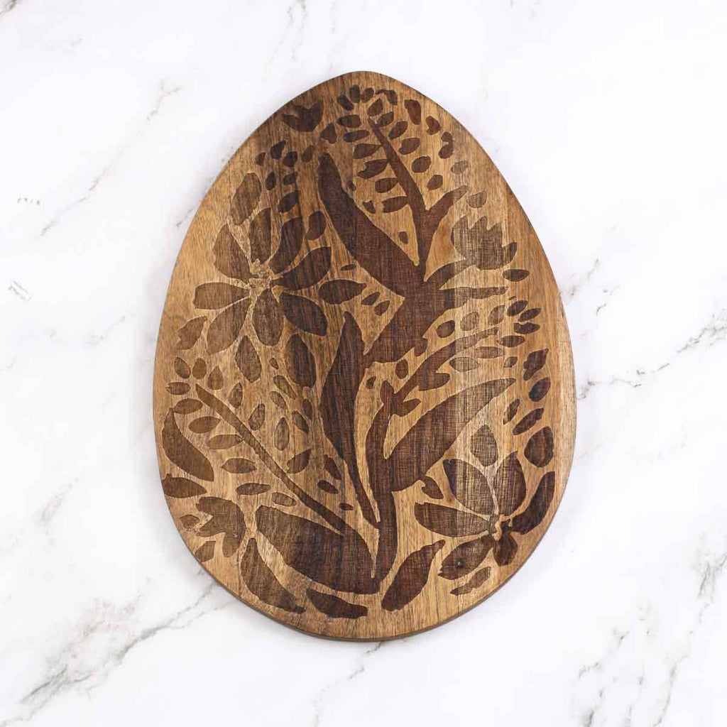 This Etched Egg Serving Board Natural is a stylish and practical addition to your kitchen. Made from high-quality wood, it features beautiful etched egg designs that add a touch of charm to any table setting. Use it to serve up your favorite appetizers, snacks, or breakfast dishes with ease. Elevate your dining experience with this unique serving board.