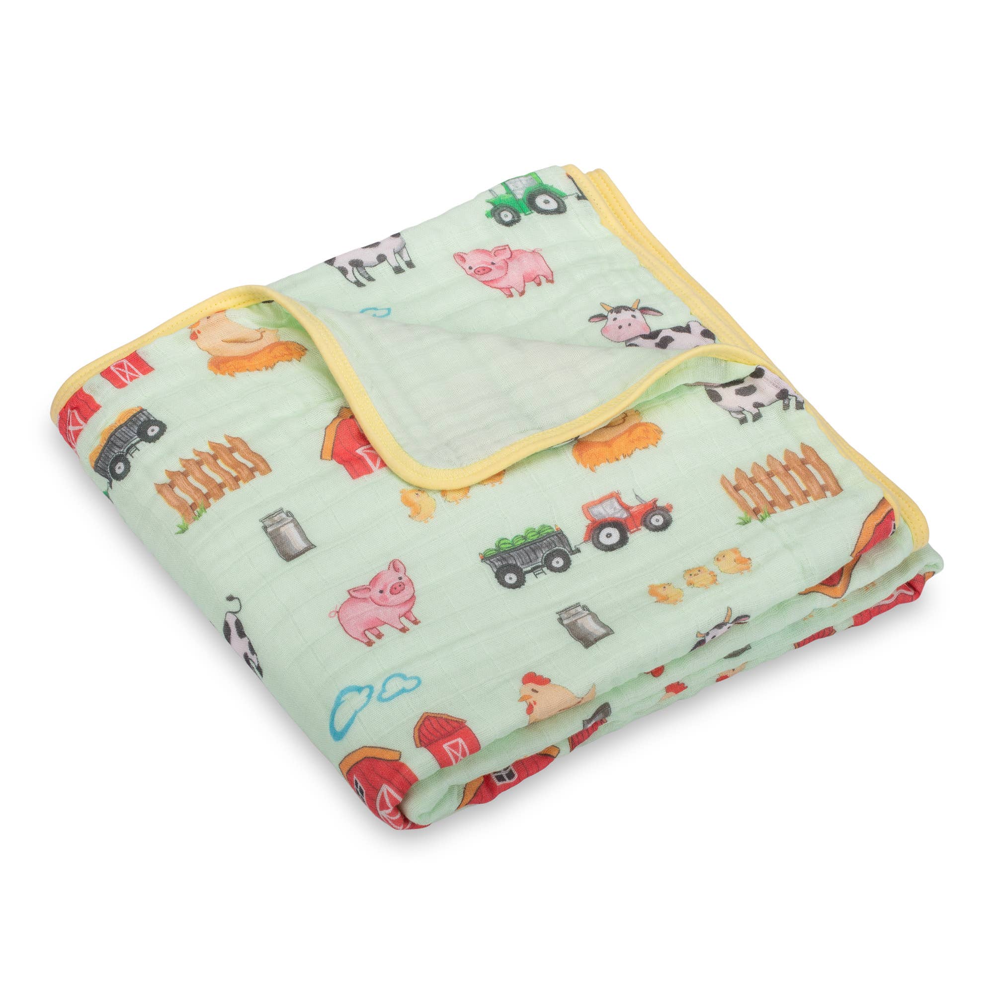 Children's blanket with farm animal and vehicle patterns on a light green background