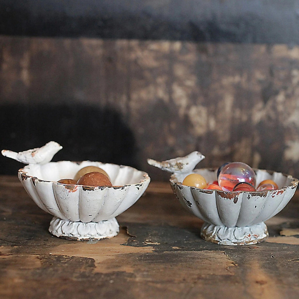  Add a touch of whimsy and charm to your home decor with our Distressed Pewter Bowl with Bird. Perfect for holding small trinkets or as a standalone piece, this bowl features a distressed pewter finish and an adorable bird detail. Available in 3 colors to match any decor. 