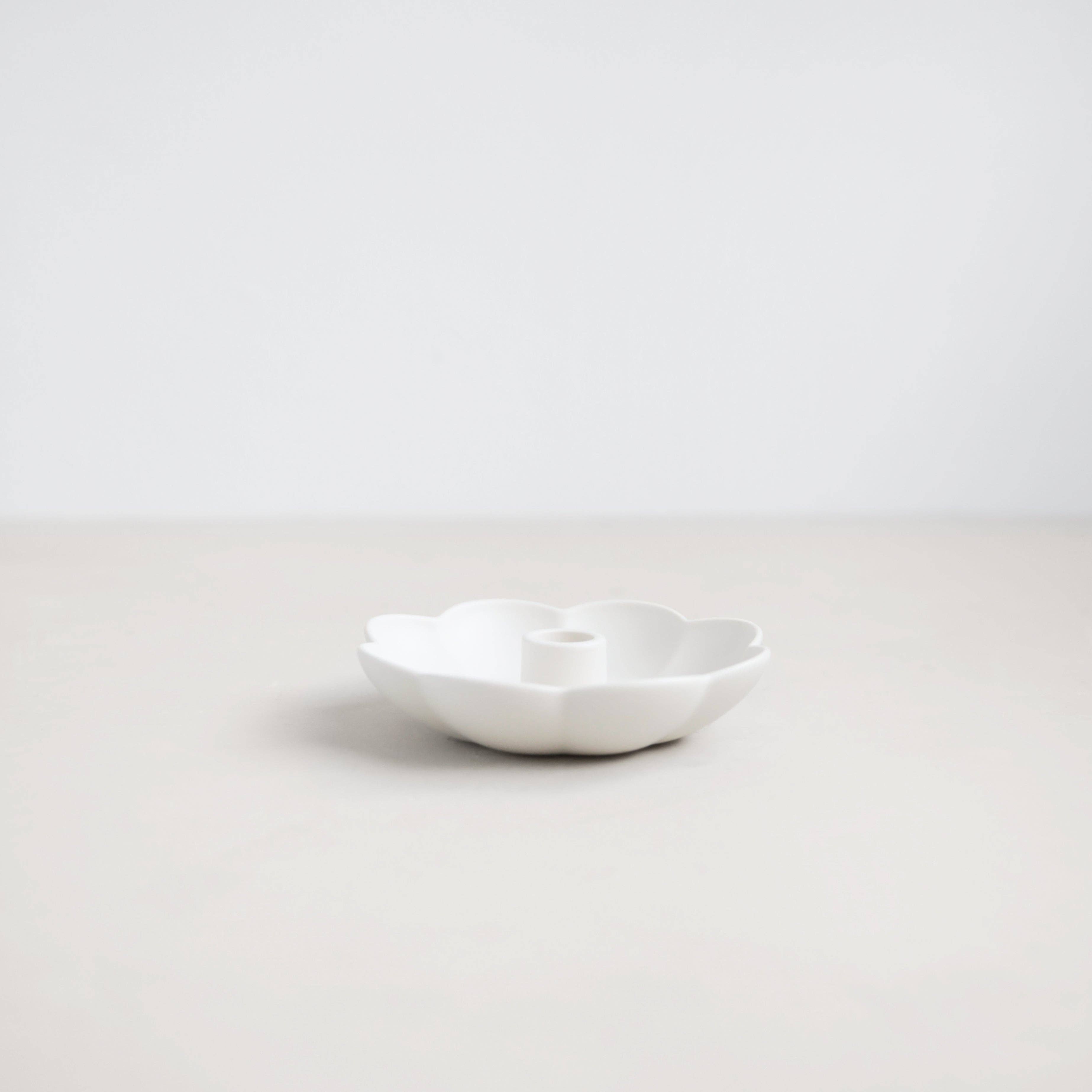 White ceramic bowl on a light gray background