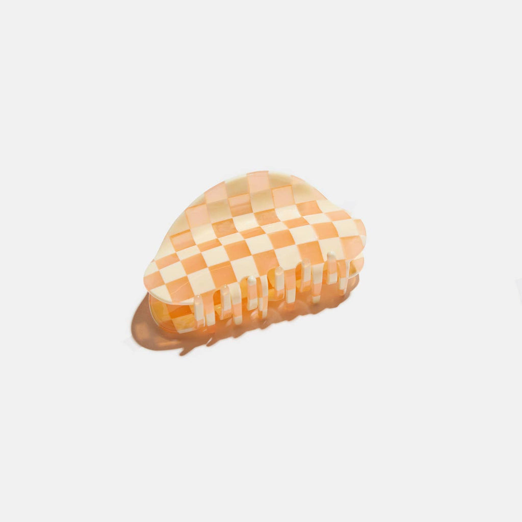 Make a statement with our Checker Claw in Frose! Our on-trend checker patterned hair claw will hold your locks in place with a touch of fashion flare. Perfect for adding a subtle but stylish twist to any look. So go ahead and claw your way to stunning tresses!