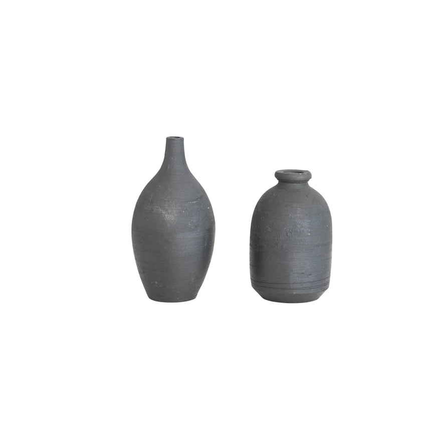 Spruce up your home decor with our Decorative Handmade Terra-cotta Mini Vase. The unique black chalkboard finish adds a touch of whimsy and doubles as a creative way to label your mini plants. Handmade with terra-cotta, each vase is one-of-a-kind 