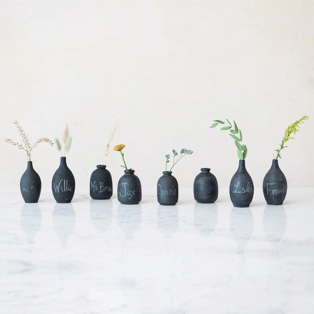 Spruce up your home decor with our Decorative Handmade Terra-cotta Mini Vase. The unique black chalkboard finish adds a touch of whimsy and doubles as a creative way to label your mini plants. Handmade with terra-cotta, each vase is one-of-a-kind 