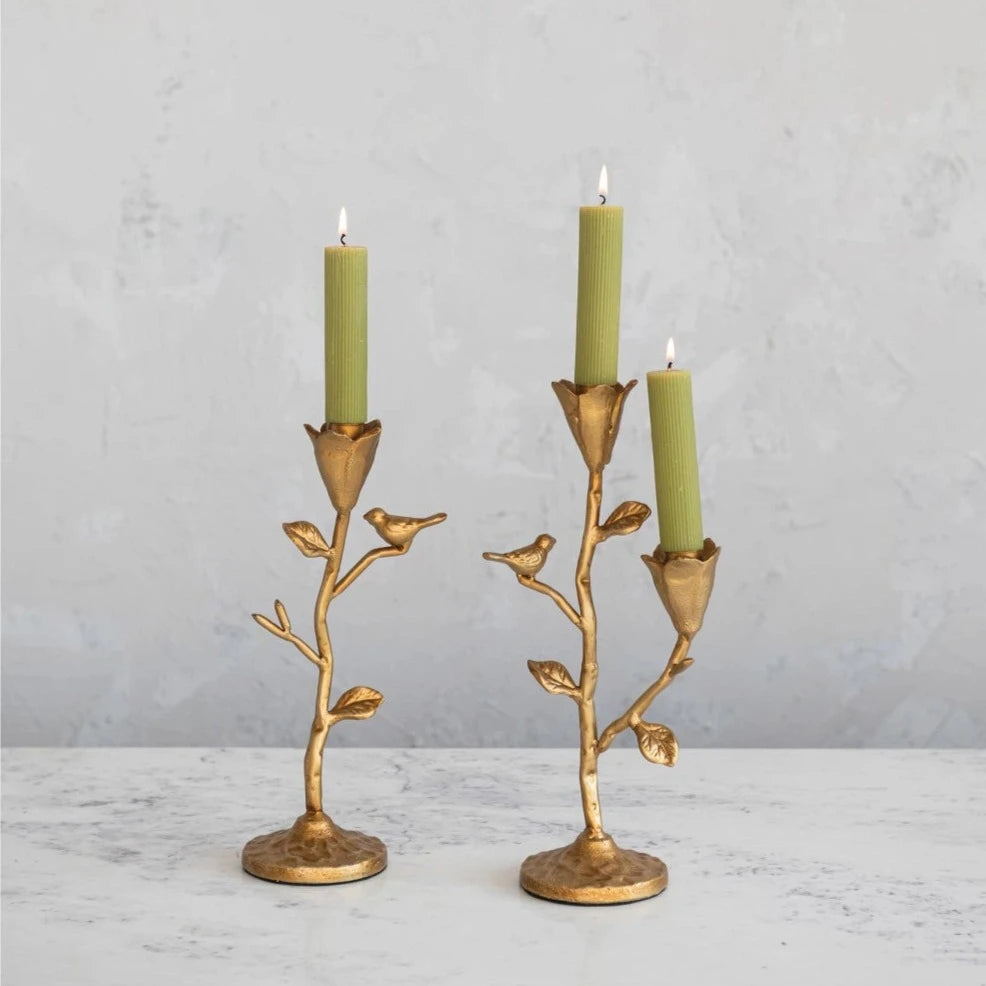 Light up your home with this one-of-a-kind, hand-forged cast iron candelabra featuring intricate flower and bird details. The perfect combination of functionality and whimsy, this decorative piece will add a touch of charm to any room.