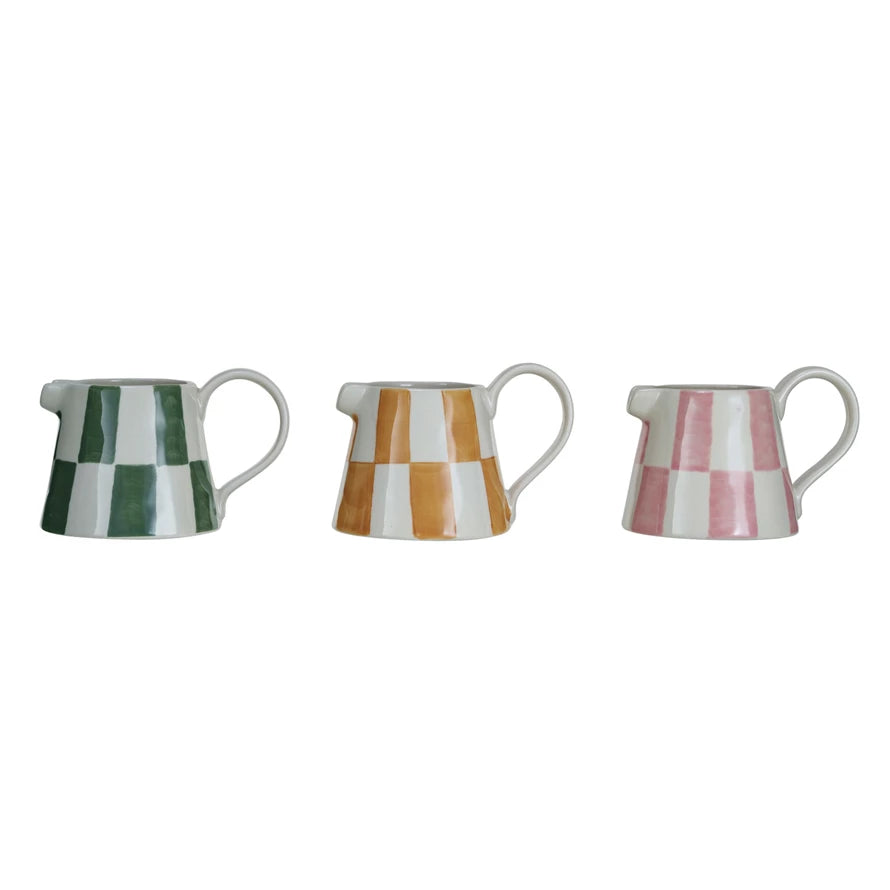 Add a playful pop of color to your morning coffee with our Hand-Painted Stoneware Creamer! Available in 3 eye-catching colors, this unique creamer is sure to bring a smile to your face. Hand-painted with love and care, each piece is a one-of-a-kind work of art. Start your day off with a little bit of fun and style.