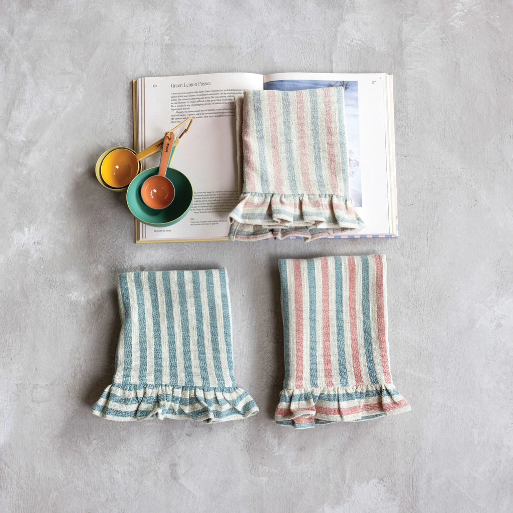 Add a touch of charm to your kitchen with our Woven Cotton Tea Towel! Designed with stripes and a ruffle detail, it's both functional and stylish. Made with high-quality cotton, it's absorbent and durable. Choose from 3 styles to fit your unique kitchen aesthetic. 
