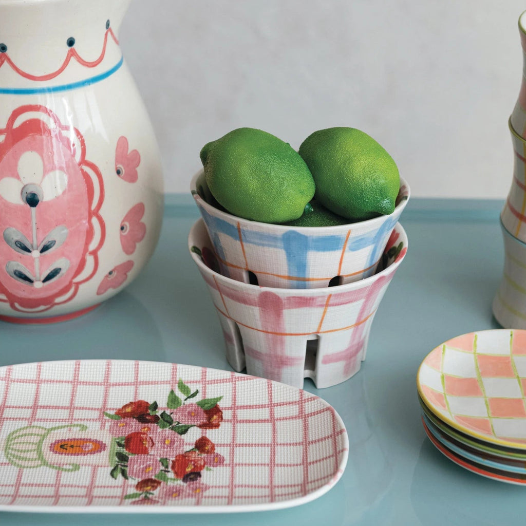 Add a touch of whimsy to your kitchen with our Hand-Painted Stoneware Berry Bowl featuring a unique plaid and floral pattern. Available in 2 styles, this bowl will make serving berries a playful and stylish experience. Perfect for adding a pop of color to your table!