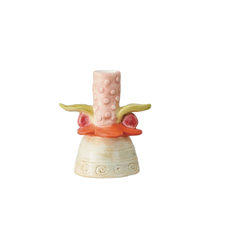 Add a whimsical touch to any room with our Hand-Painted Stoneware Flower Taper Holder. Each holder is hand-painted, creating a unique and playful piece. Bring some fun and cheer to your home with this quirky and functional candle holder. 4"L x 3-1/4"W x 4-1/2"H