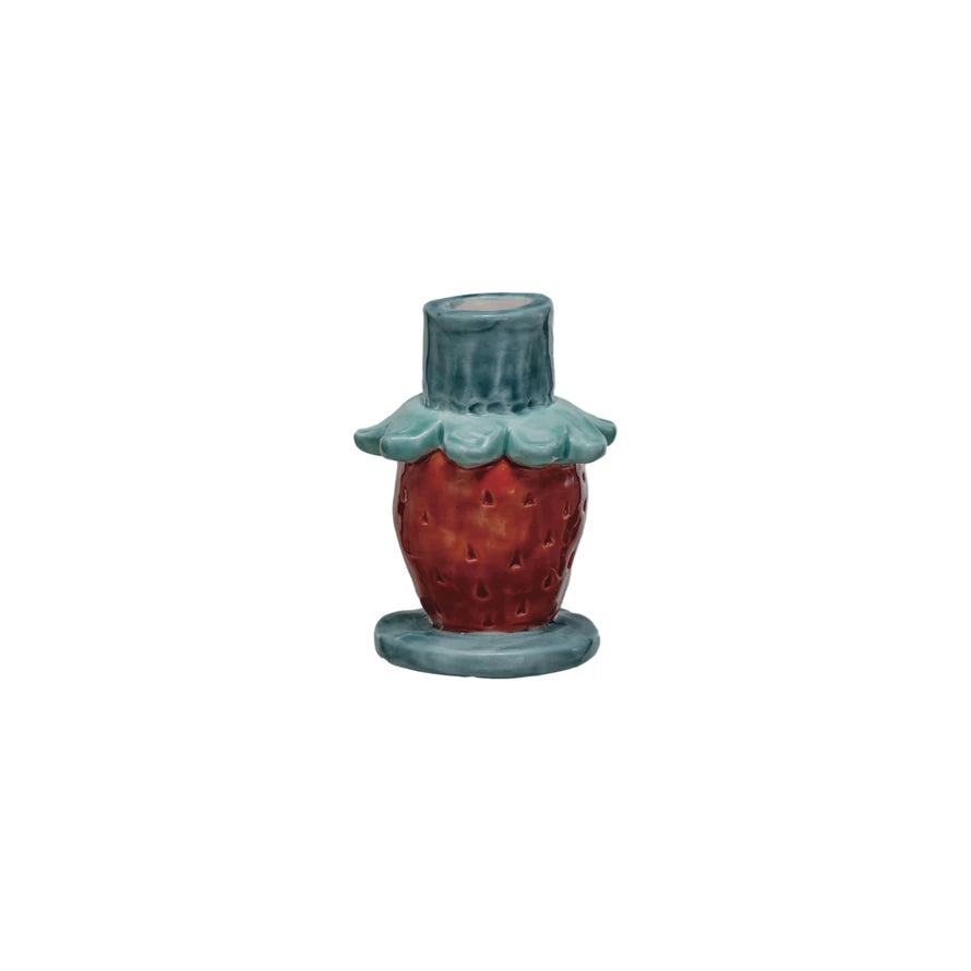 Add a pop of color to your home with this hand-painted stoneware flower taper holder. Each piece is unique and adds a touch of whimsy to any room. Perfect for holding taper candles, this holder is both functional and fun. 2-1/2" Round x 3-3/4"H
