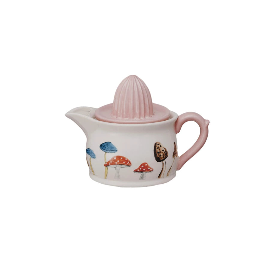 Add a whimsical touch to your kitchen with our Hand-Painted Stoneware Juicer/Pitcher! The unique mushroom design adds fun and charm while perfectly serving juice or pouring water. Enjoy a delightful and practical addition to your home.