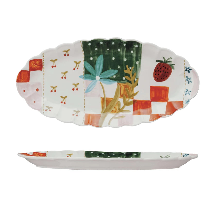 This Picnic Daydream Stoneware Platter captures the essence of leisurely afternoons in the sun. The oval shape and scalloped edges frame the pastoral picnic art, creating a storybook setting for varied culinary creations. Whether laden with sandwiches and lemonade for a garden party or showcasing hors d'oeuvres in a more formal setting, this platter brings a sense of nostalgia and charm.