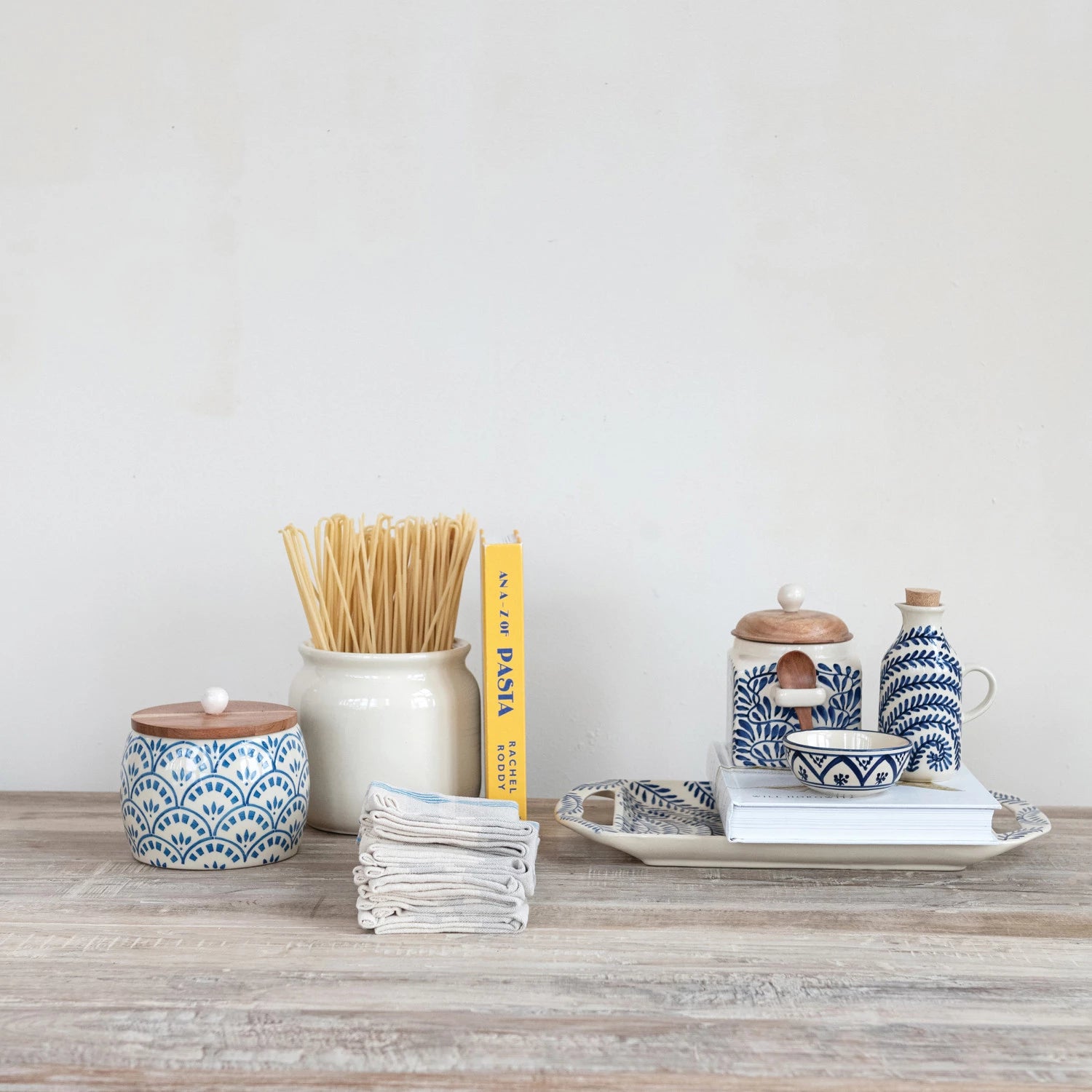 Serve up smiles with this Hand-Painted Stoneware Bowl in creamy tones and cheerful blue patterns! Perfect for everything from morning cereal to midnight snacks, its playful design adds a pop of color and charm to your table. Each bowl is uniquely crafted, making every meal feel a little more special and a lot more fun! 4" Round x 1-1/2"H