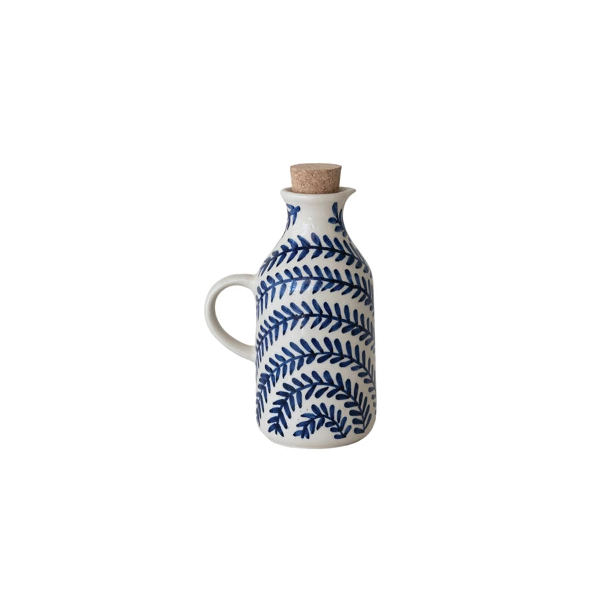 Drizzle with delight using this 8 oz. Hand-Painted Stoneware Oil Cruet! Featuring a charming design and a snug cork stopper, it keeps your oils fresh and your kitchen looking fabulous. Perfect for adding a splash of style to your cooking routine, this playful cruet makes every pour a little more fun! 3-3/4"L x 2-3/4"W x 5-3/4"H