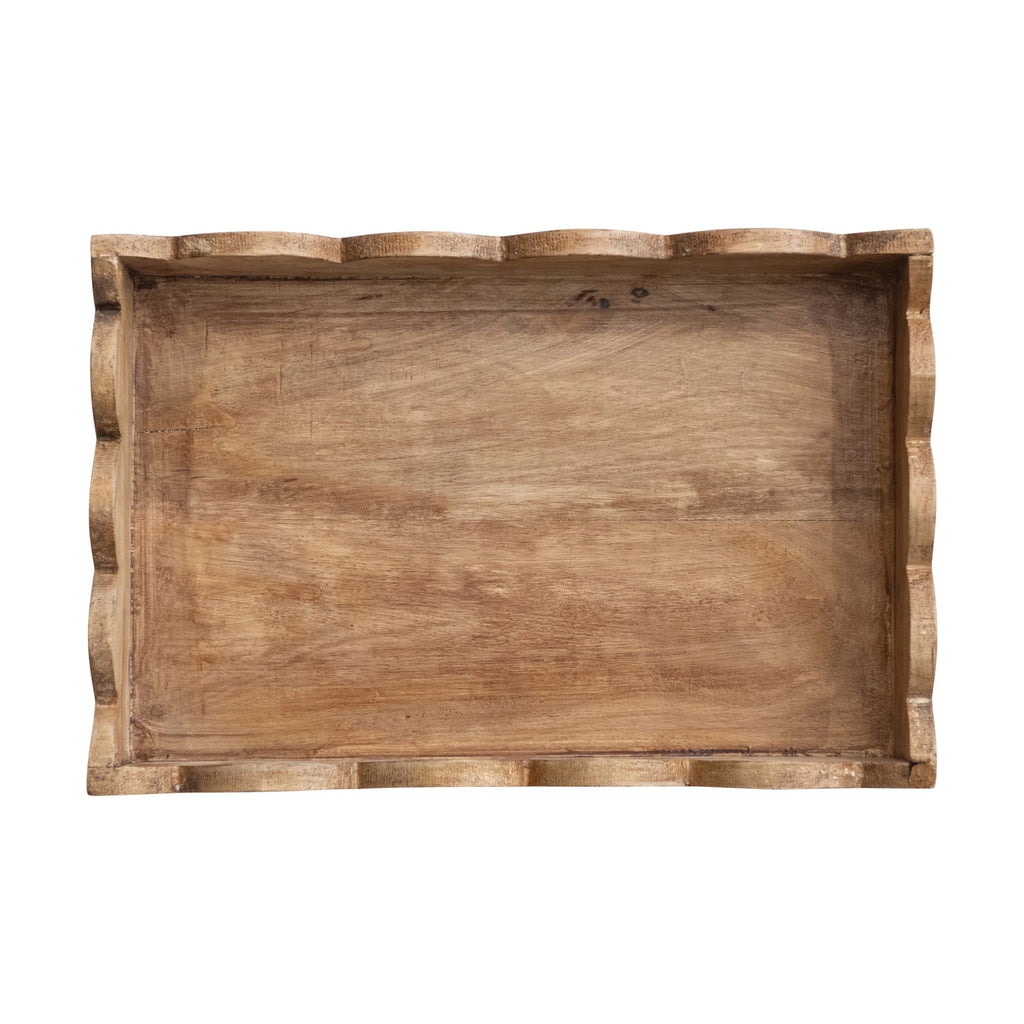 Introducing our Mango Wood Scalloped Tray, the perfect addition to your home decor! Crafted from sustainable mango wood, this unique tray features a delightful scalloped edge design. Use it to serve your favorite dishes or as a decorative centerpiece. A charming touch to any room!