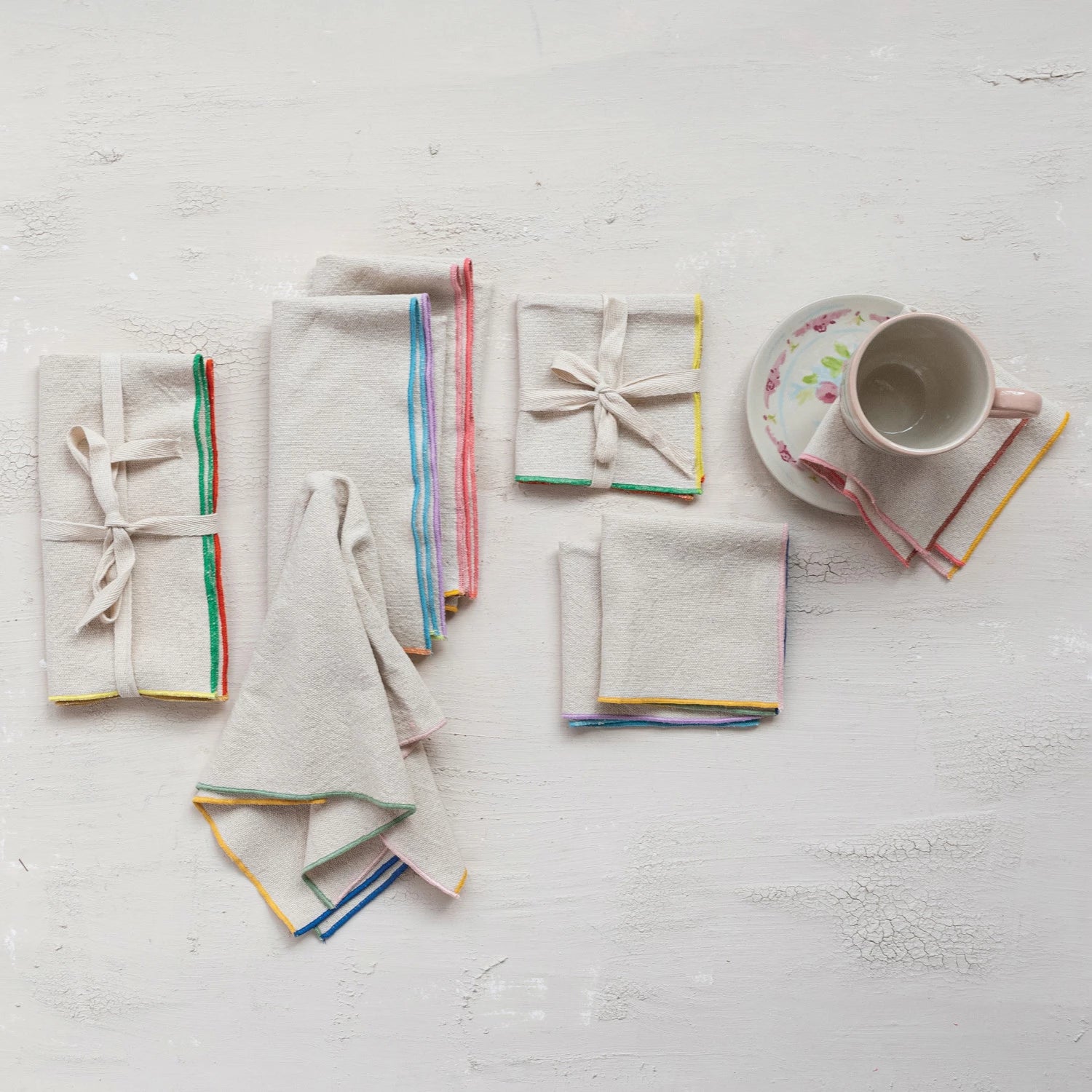 Make your dining experience colorful and charming with our Woven Cotton Napkins! These napkins feature a stitched colored edge, adding a playful touch to any table setting. Made of high-quality cotton, they're durable and easy to clean, making them the perfect addition to your kitchen. Set of 4 included.