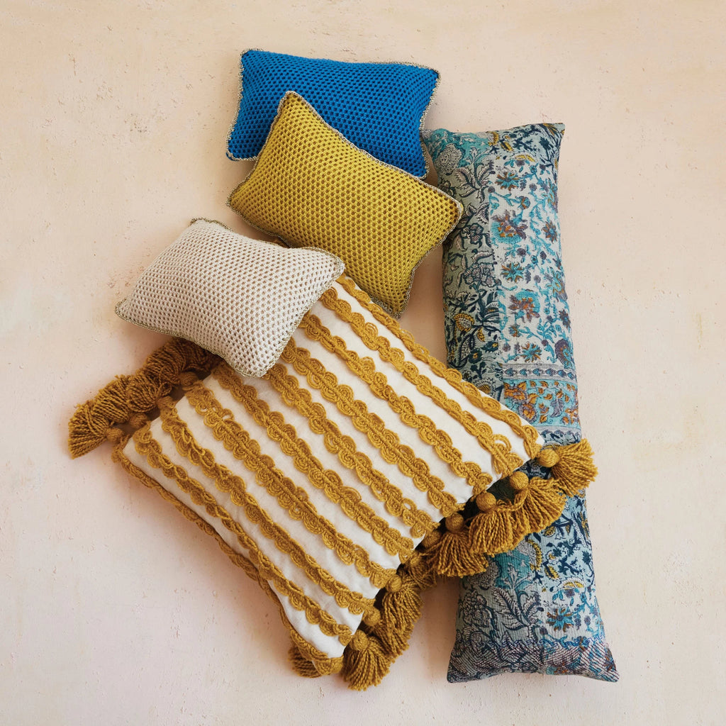 Add a touch of boho charm to your home decor with our Woven Cotton Pillow. Featuring playful Ric Rac stripes and tassel accents, this pillow is both stylish and cozy. Made from high-quality cotton, it's the perfect addition to any couch, chair, or bed.