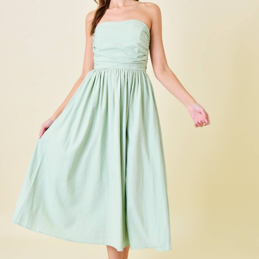 Look effortlessly chic in our Strapless Midi Dress in Sage! This stylish dress features a strapless design that is perfect for warmer weather and a flattering midi length. Its sage color adds a touch of sophistication, while the strapless design allows for comfortable and versatile wear. A must-have for any fashion-forward individual!