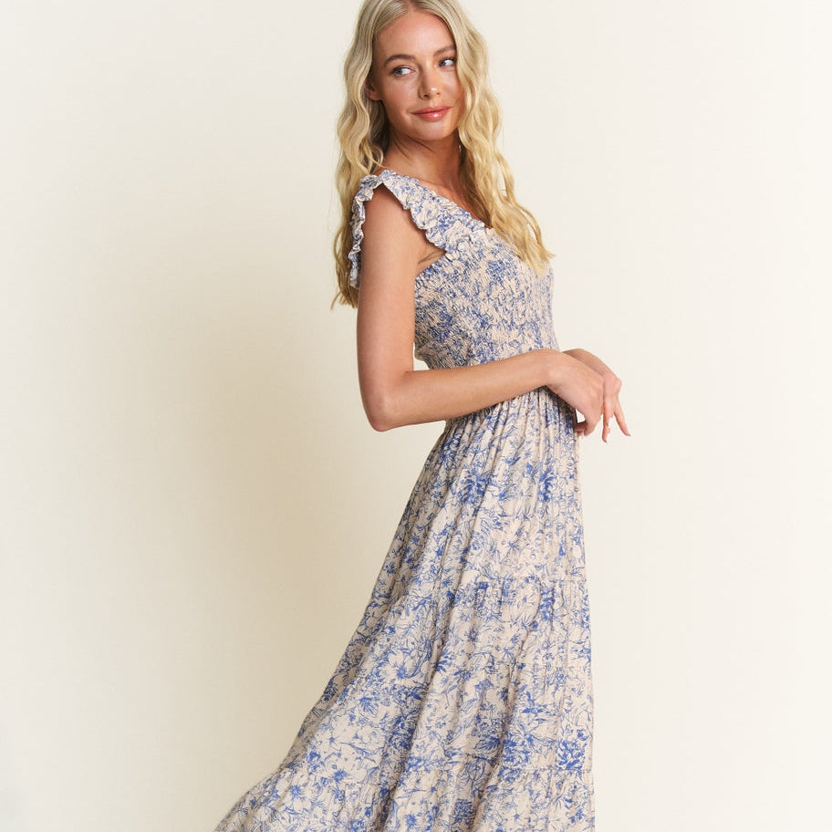 Get ready to turn heads in our Blue Combo Smocked Floral Print Midi Dress! This unique dress boasts a playful floral print and a flattering smocked design. Perfect for any occasion, this dress will have you looking and feeling your best. Don't miss out on this quirky and fun addition to your wardrobe! Sleeveless bodice, Fitted top, Loose fit bottom, Maxi/ankle length dress, 45% Rayon&nbsp; 55% Linen