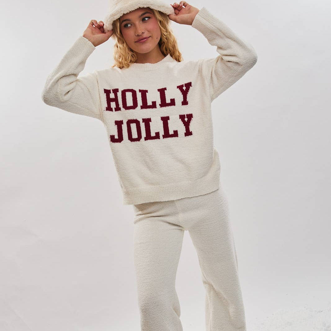 Spread holiday cheer with this cozy matching set featuring a soft, fuzzy long-sleeve sweater top and coordinating sweater pants. The top showcases a cheerful "holly jolly" design that captures the spirit of the season. Perfect for festive gatherings, family photos, or simply embracing the warmth and comfort of the holidays. This coordinated ensemble brings together style and coziness for a look that celebrates the joy of the season.

Details:

Top & bottom included
Model is wearing a size small / height