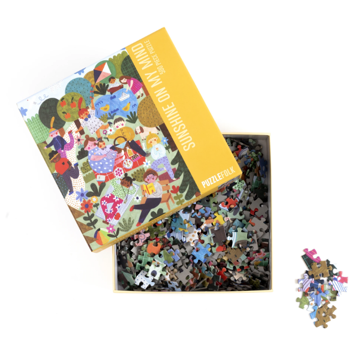 A fun, bright puzzle featuring friends and families enjoying the afternoon sunshine in the park! We hope you love this puzzle to pieces!  500 piece puzzle  Finished puzzle dimensions - 16.5" x 22.5"