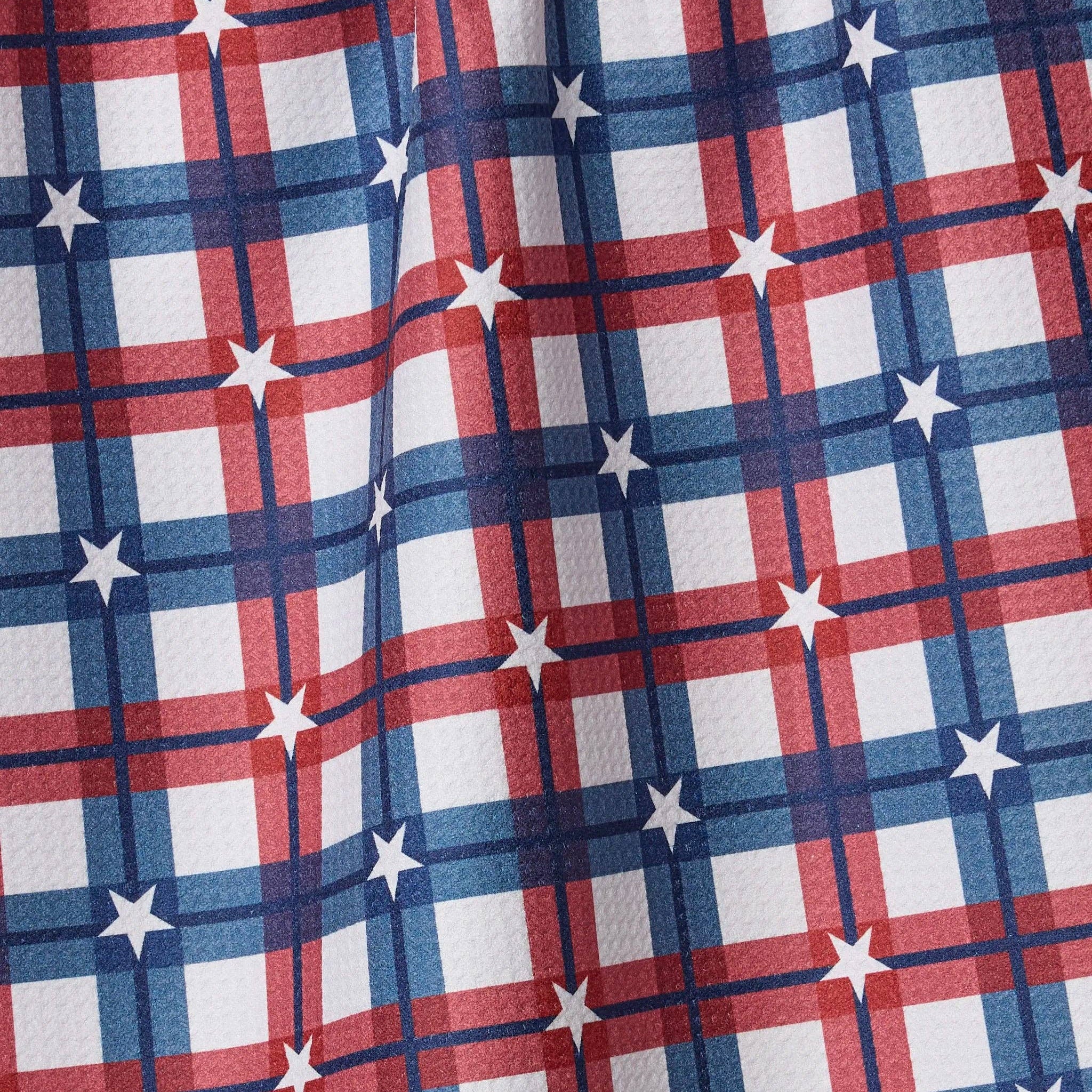 Fabric  of tea towel with red, white, and blue plaid pattern