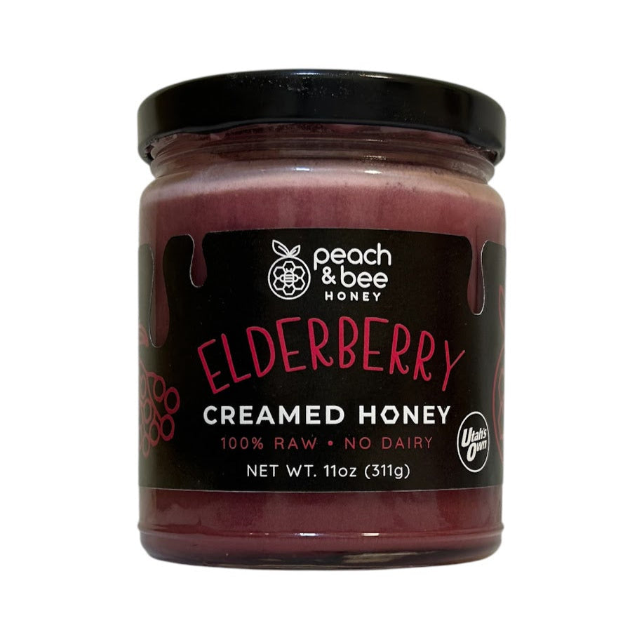 elderberry flavored  creamed honey in an 11 oz glass jar